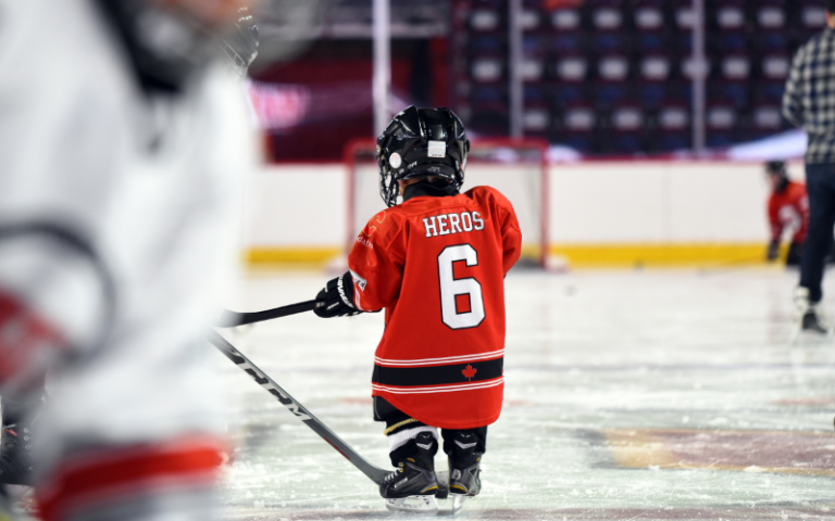peewee hockey player on the ice